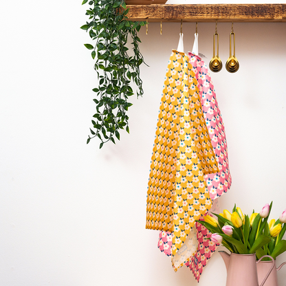 Pair of pretty floral print tea towels with handy hanging loop. Includes one Rose pink and one honey yellow tea towel.