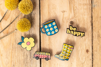 Enamelhappy Pin Badges beautiful Set of all Five. Includes a Happy Cup of Tea Blue Cup, Be Happy in Retro Typographic, Yellow Floral Wellies, Pink Floral Campervan, and Our Pretty Pink Retro Inspired Flower! What's not to LOVE!